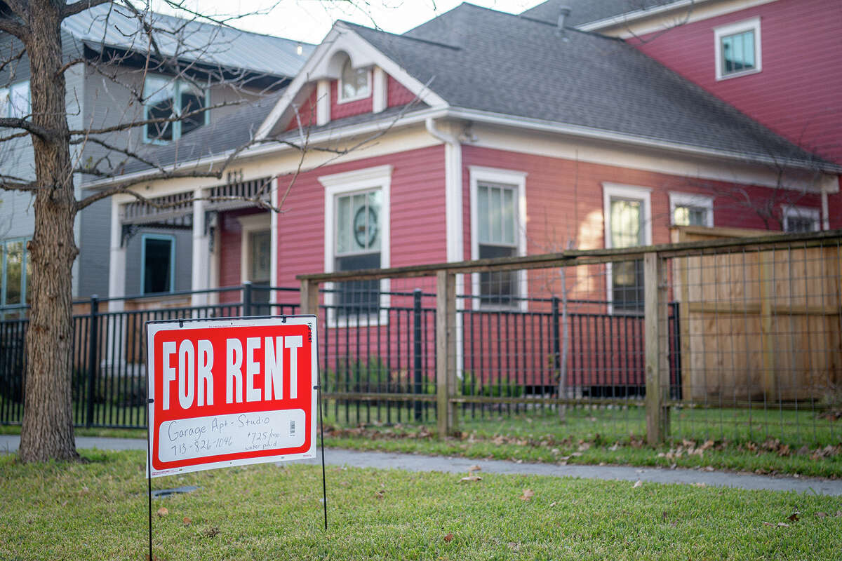 A "For Rent" sign is posted near a home on Feb. 7, 2022, in Houston, Texas. Since March 2020, the estimated median rent of new leases has increased by double digits in several Texas cities. (Brandon Bell/Getty Images/TNS)