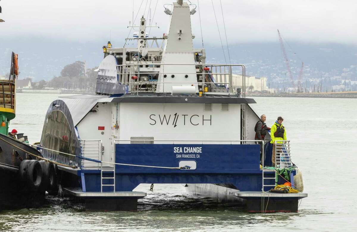 Crews tow the Sea Change to Pier 9 in San Francisco on Sunday after its journey from Washington state.