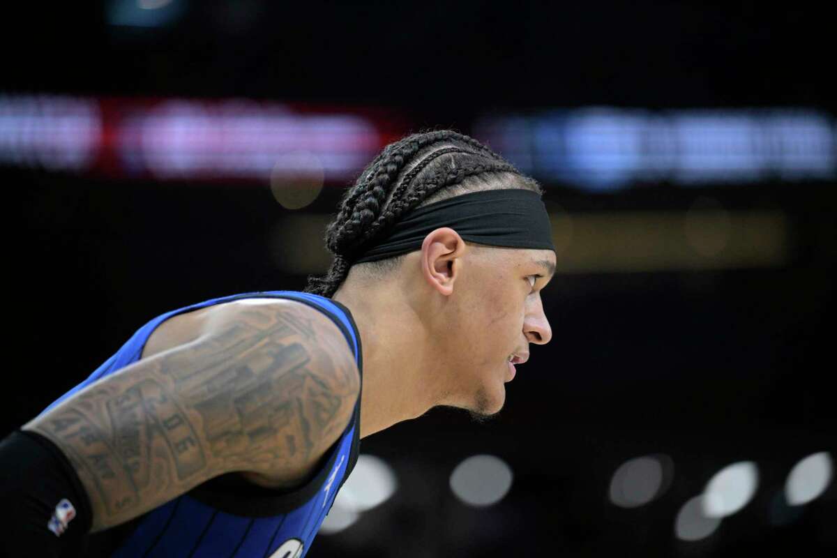 Orlando Magic forward Paolo Banchero (5) stands on the court during the first half of an NBA basketball game against the Miami Heat, Saturday, March 11, 2023, in Orlando, Fla. (AP Photo/Phelan M. Ebenhack)
