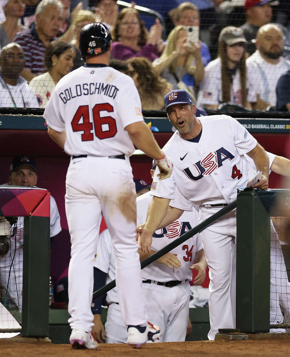 Manager Mark DeRosa #4 of Team USA congratulates Paul Goldschmidt #46 after scoring a run against Team Great Britain during the fourth inning of the World Baseball Classic Pool C game at Chase Field on March 11, 2023 in Phoenix, Arizona. Team USA defeated Team Great Britain 6-2.
