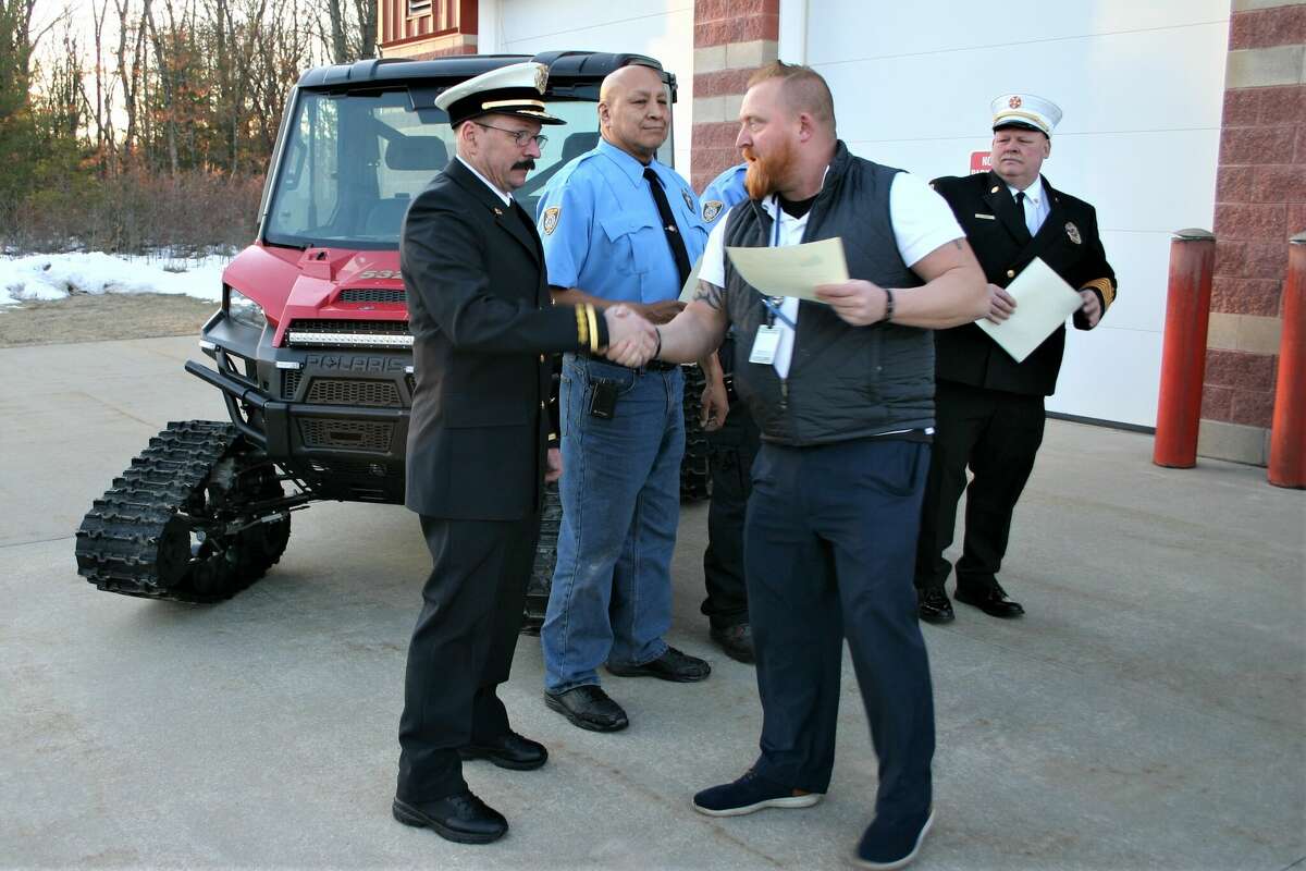(Left to right) Lake County Emergency Management director Patrick Maddox recognized Yates Fire Chief Eric Meehan, Webber Township Firefighters Corey Holmes and Robert Engstrom, and Webber Township Fire Chief Alan Dailey for service to a resident in need.