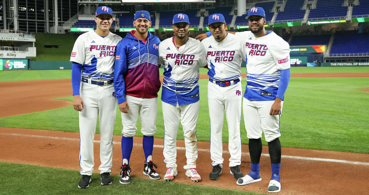 MIAMI, FLORIDA - MARCH 13: (L-R) Pitchers Yacksel Rios #75, Jose De Leon #87, Catcher Martin Maldonado #15, Edwin Diaz #39 and Duane Underwoond Jr. #56 pose for a photo after throwing a combined no-hitter against Israel at loanDepot park on March 13, 2023 in Miami, Florida. (Photo by Eric Espada/Getty Images)