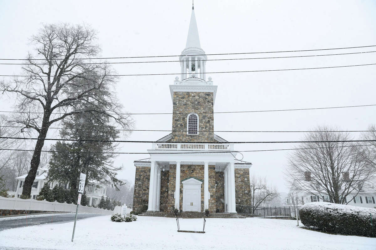 Snow falls in Ridgefield, Conn. on Tuesday, March 14, 2022.