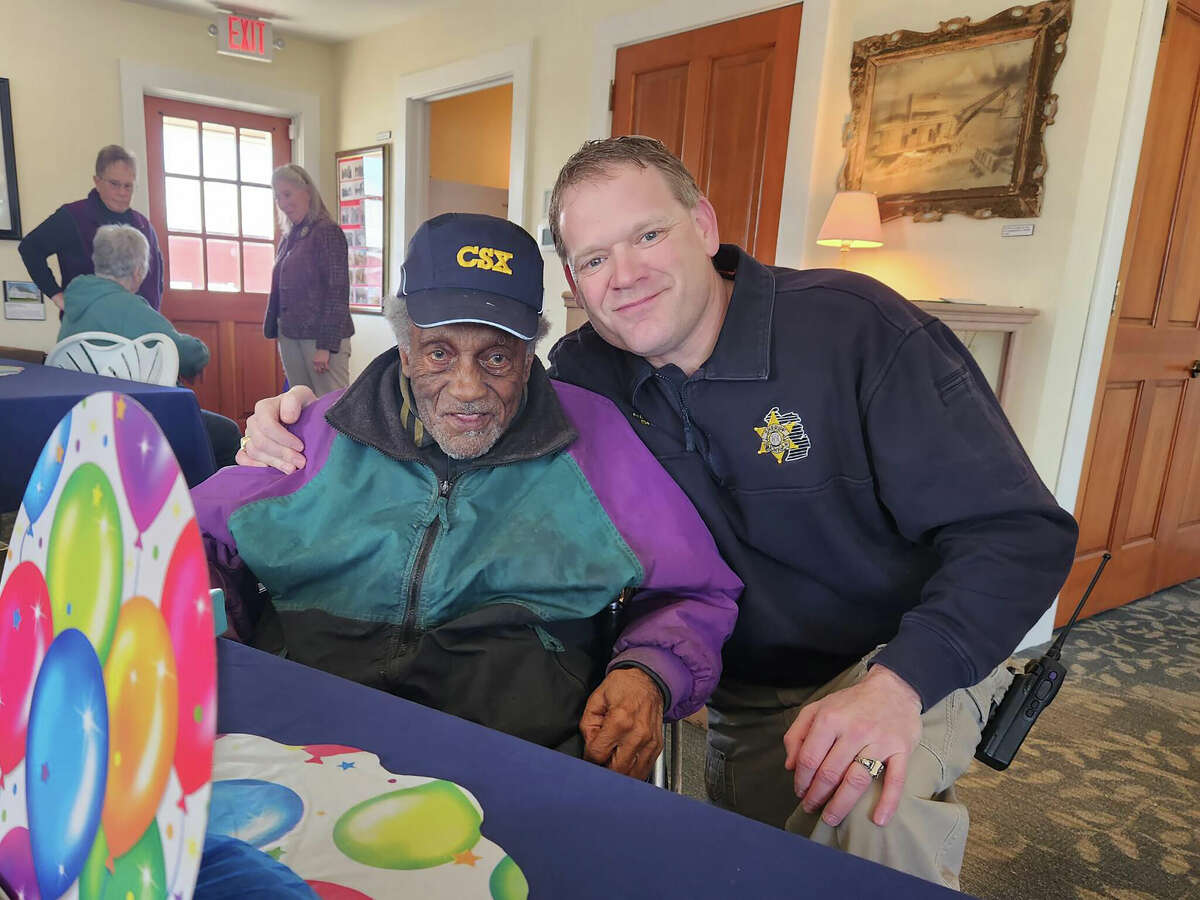 A longtime resident of Lake County celebrated his 98th birthday March 7 with local law enforcement and other community members. Clarence Vicent (left), retired from the Pere Marquette Railroad after 40 years of service and is also an active trustee for the Village of Baldwin, where he has served for over 30 years. Vicent — who originally settled in Peacock and now lives in Badlwin with his family — was also accompanied by Lake County Sheriff Richard Martin (right).