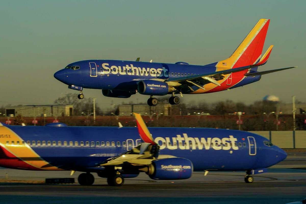 FILE - Southwest Airlines plane prepares to land at Midway International Airport, Feb. 12, 2023, in Chicago. The CEO of Southwest Airlines pushed back Tuesday, March 14, against the view that his airline’s December breakdown was caused by a failure to invest enough money in crew-scheduling technology, instead blaming extremely cold weather that forced it to stop flying at some airports.