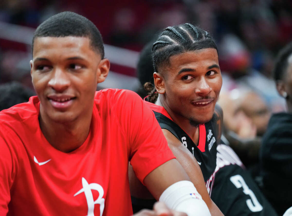 Jalen Green #4 and Jabari Smith Jr. #1 of the Houston Rockets look on from the bench during the game against the Oklahoma City Thunder at Toyota Center on November 26, 2022 in Houston.