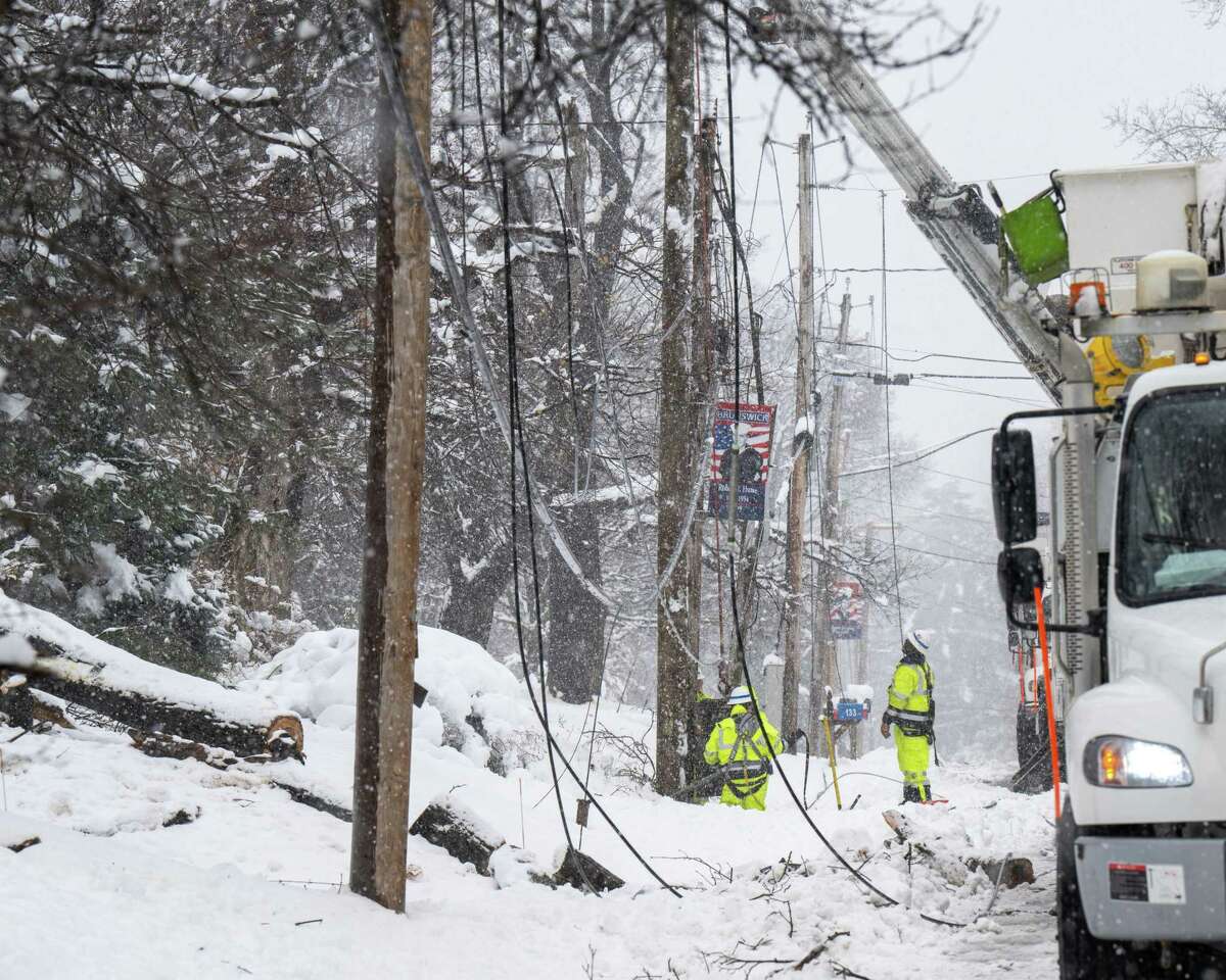 A crew from National Grid repairs downed wires along Route 2 on Tuesday, March 14, 2023, in Brunswick, NY.