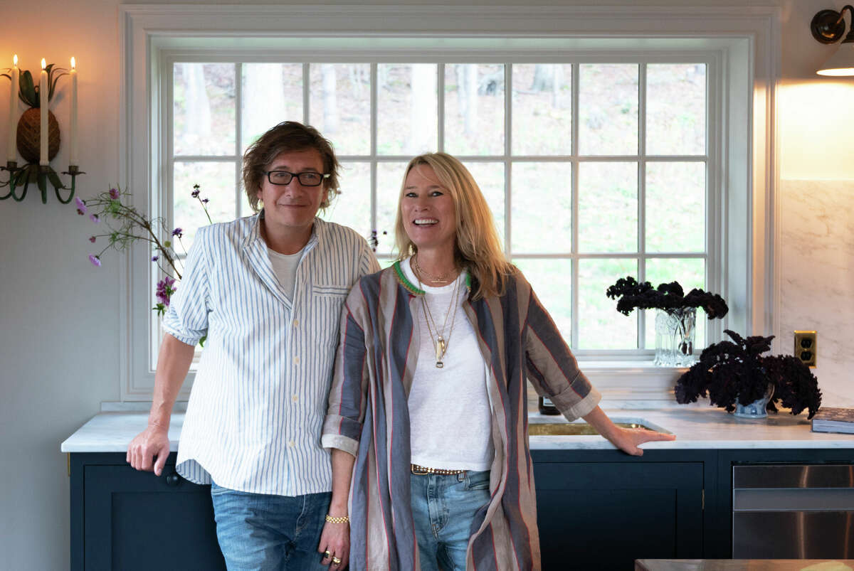 Paul O'Leary and Helen Parker pose in the remodeled kitchen in Cornwall, Conn. for Magnolia Network's series "For The Love Of Kitchens."