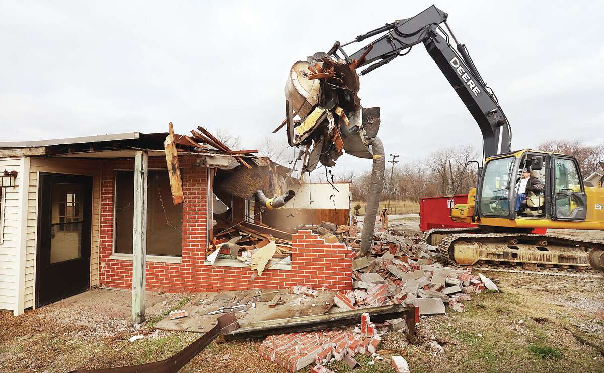 A trackhoe makes quick work of the old Dee-Lux Diner building at 700 S. Central Ave. in Roxana Tuesday morning. Plans to re-hab the building were changed to tearing it down and erecting a new structure for the restaurant. A delay of materials will push construction off until 2024.