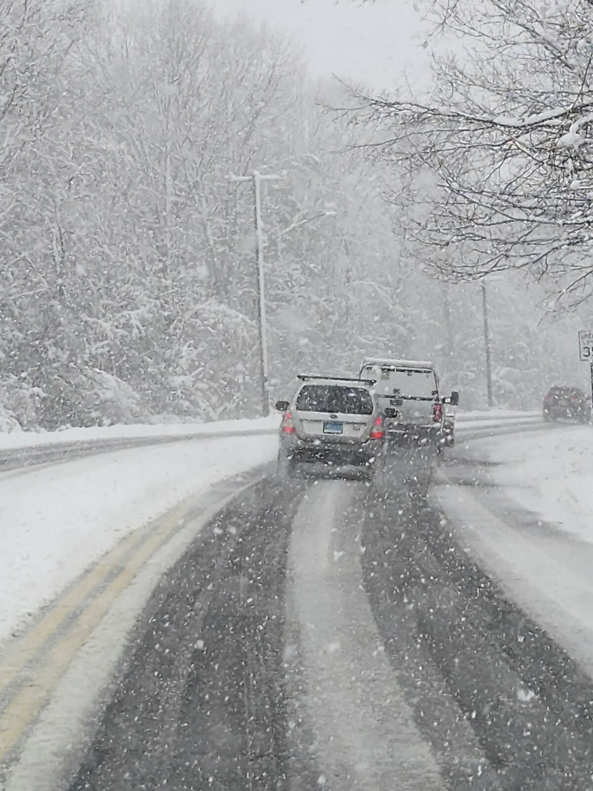 Roadways in and around Torrington were covered with blowing snow by mid-afternoon Tuesday, March 14. Pictured are vehicles on Kennedy Drive. 