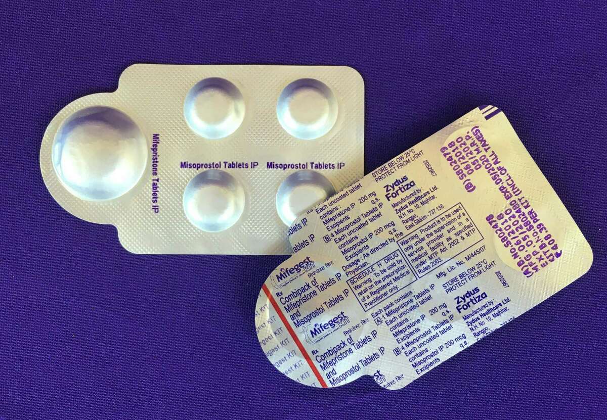 A combination pack of mifepristone (left) and misoprostol tablets, two medicines used together for a medication abortion.