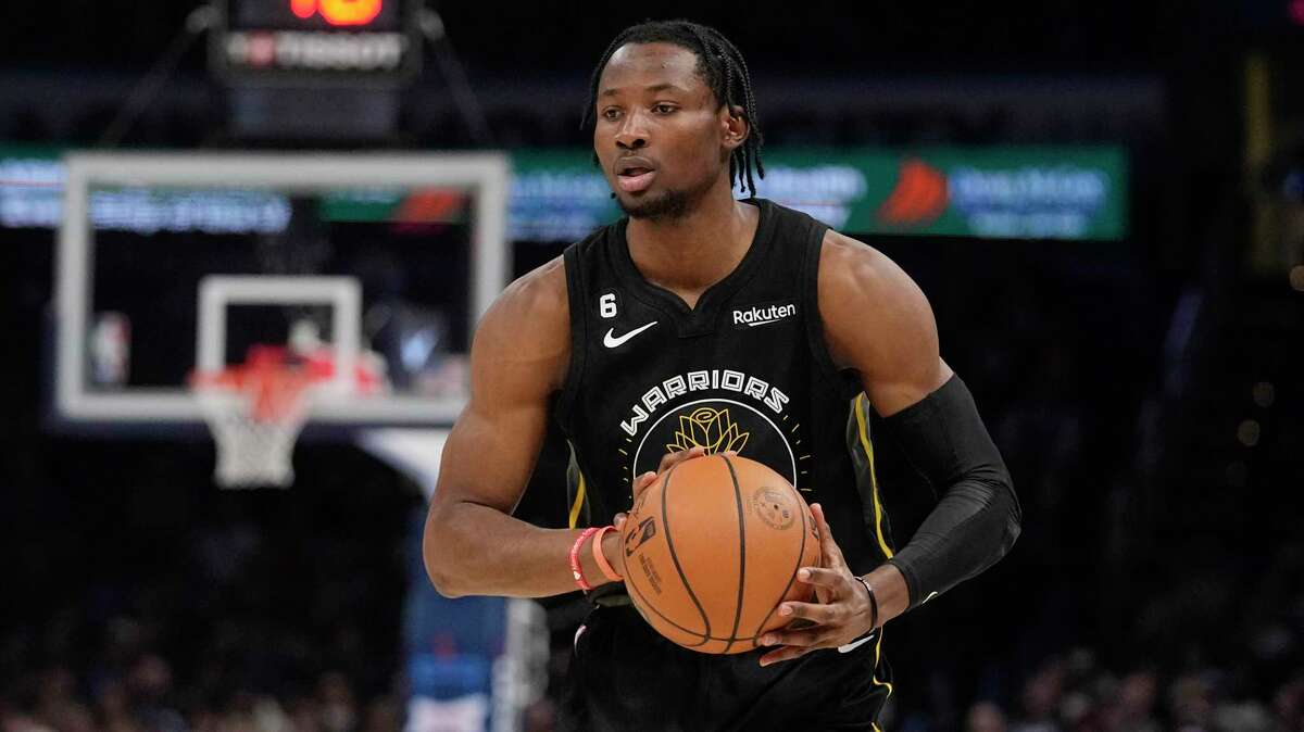 FILE - Golden State Warriors forward Jonathan Kuminga stands on the court  during the second half of an NBA basketball game against the Los Angeles  Clippers Monday, Feb. 14, 2022, in Los