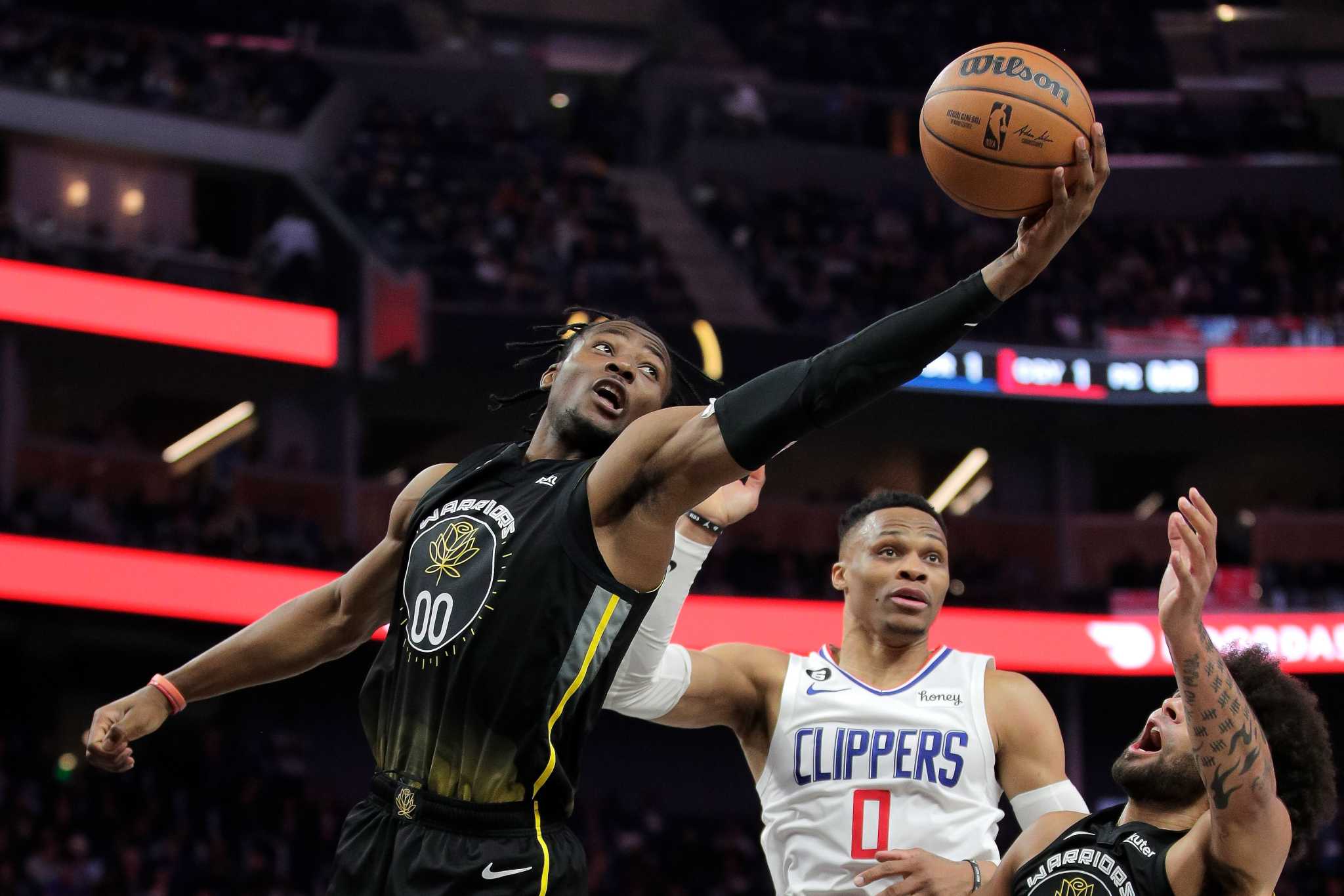 FILE - Golden State Warriors forward Jonathan Kuminga stands on the court  during the second half of an NBA basketball game against the Los Angeles  Clippers Monday, Feb. 14, 2022, in Los