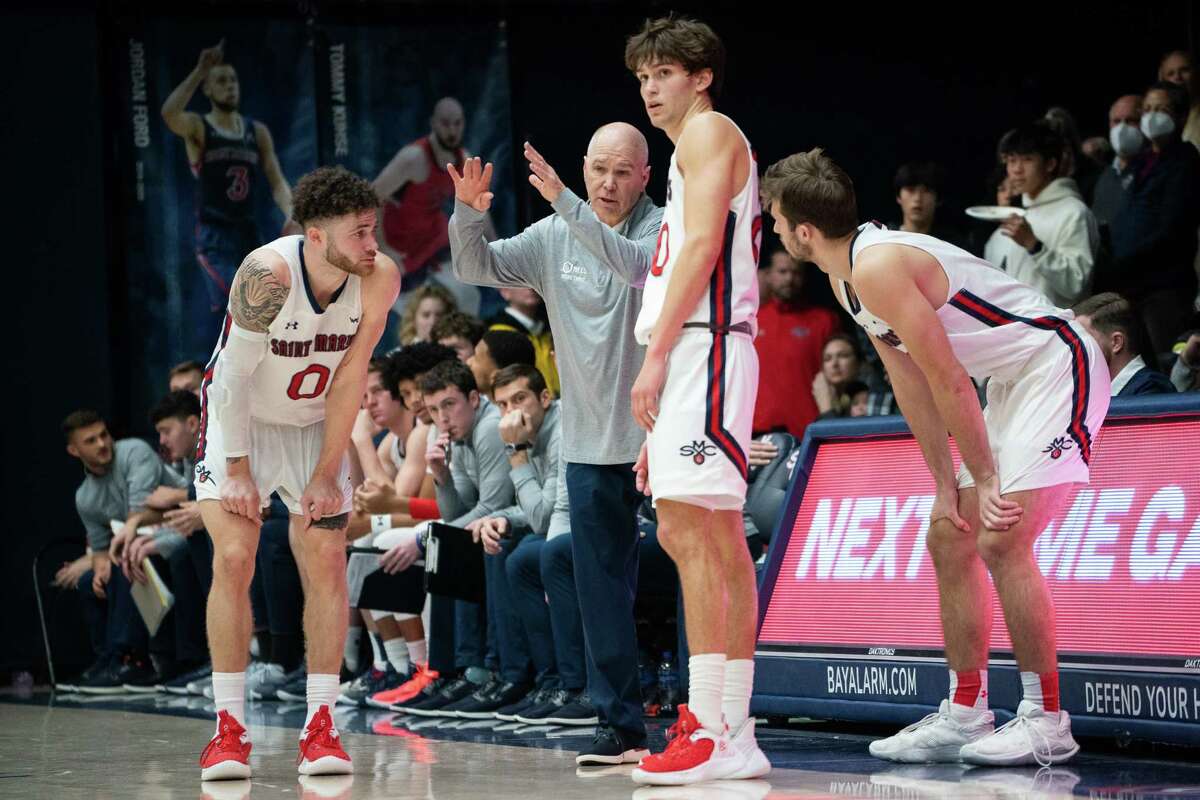 St. Mary’s head coach Randy Bennett (center) has made postseason appearances a regular occurrence for his Gaels. But extended runs in the NCAA Tournament largely have been elusive.