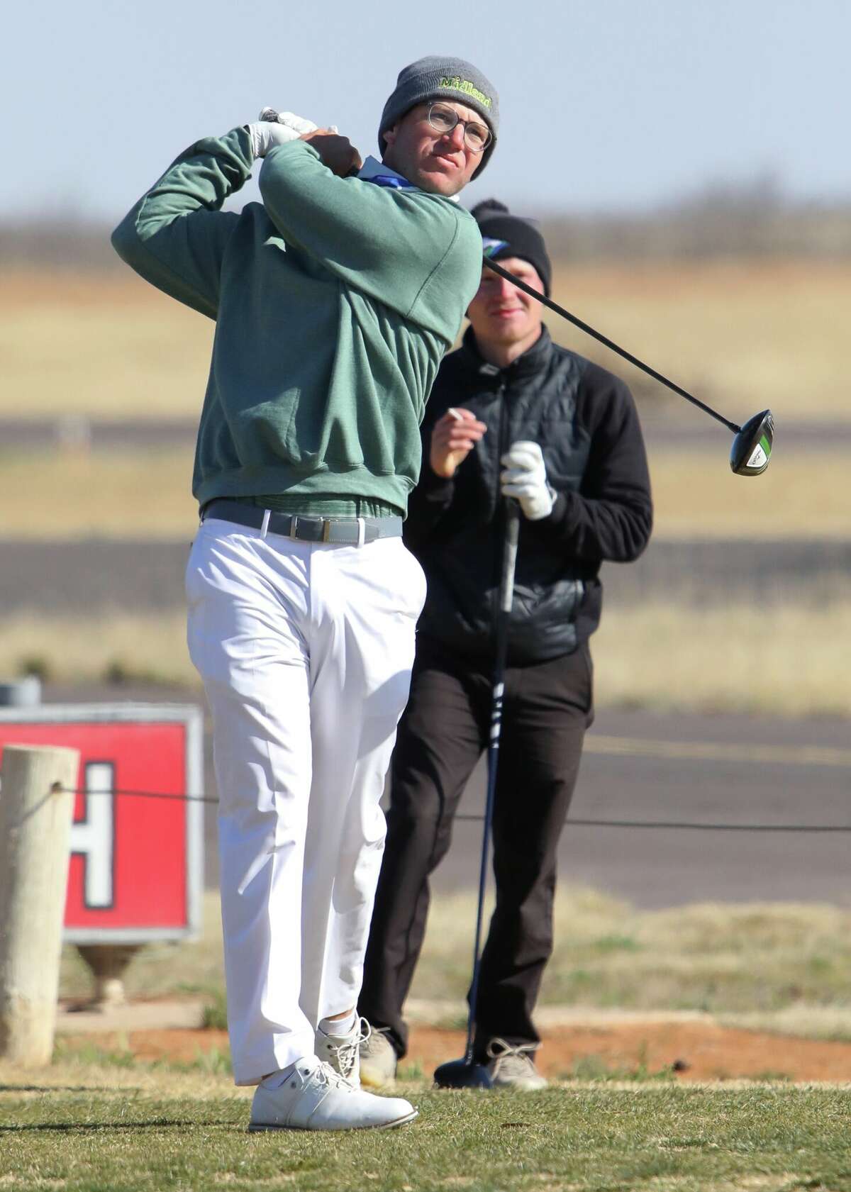 Midland College's Chris Wardrup watches his tee shot during the TankLogix/Midland College Tournament, March 14 at Andrews Country Club.
