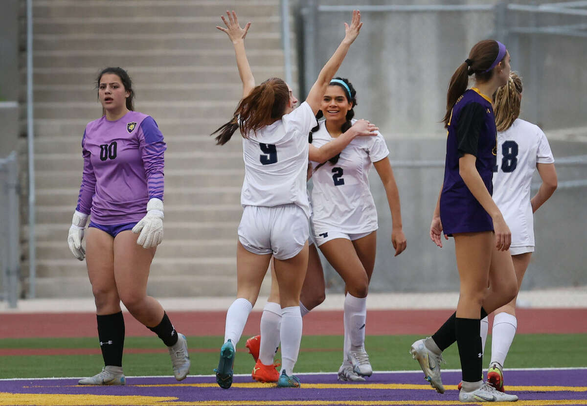 Smithson Valley’s Alex Smithwick (02) gets congratulated by teammates after scoring the go-ahead goal in the second half against Pieper during their girls soccer game at Pieper on Tuesday, Mar. 14, 2023. Smithson Valley won the match, 5-3, to go undefeated in district season competition.