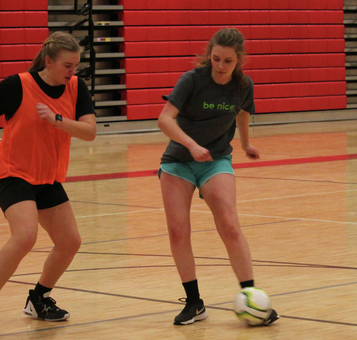 Reed City's Alex Stein (right) works with the ball against teammate Kaylin Smoes during a Tuesday practice at the Reed City Middle School.