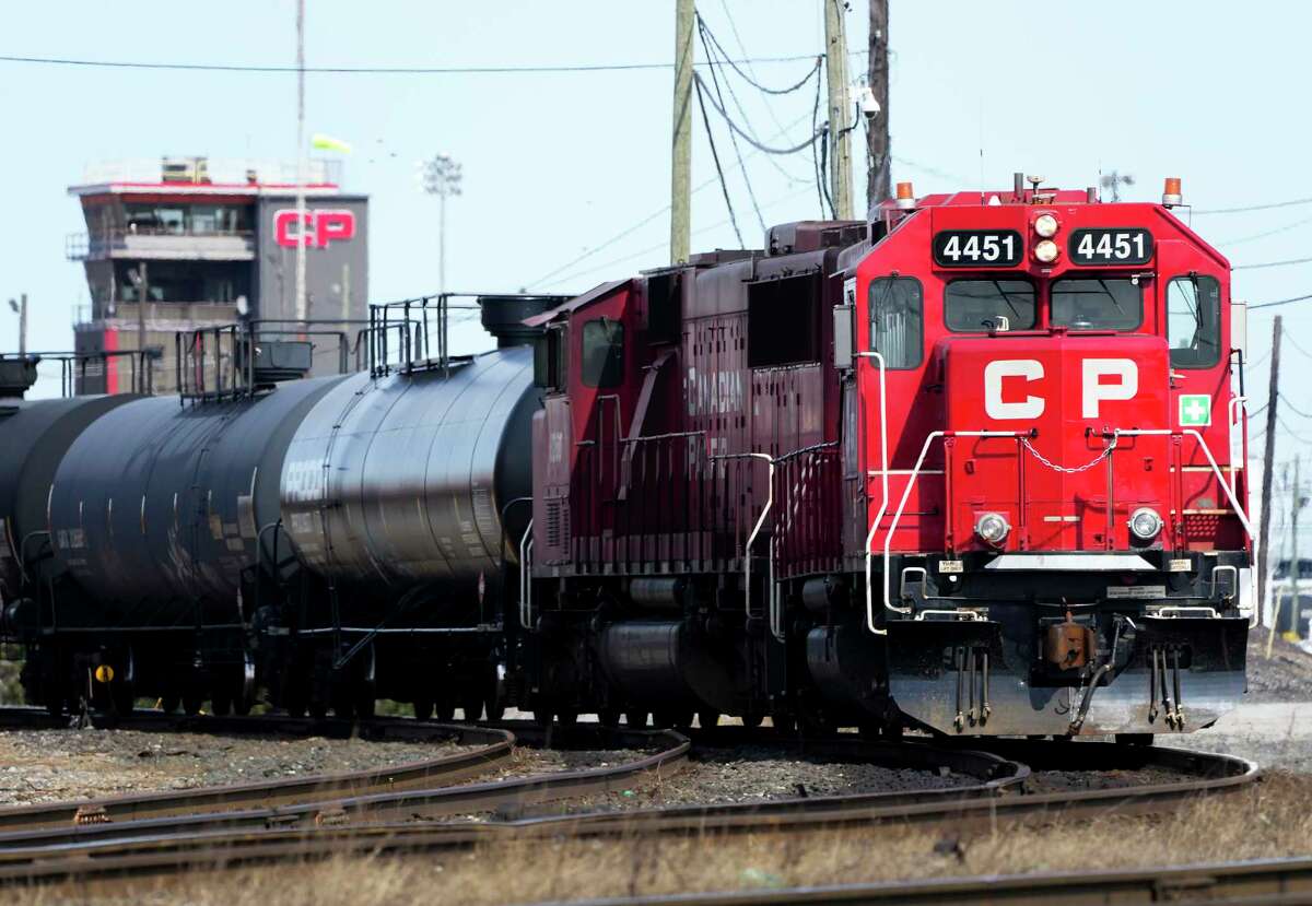 Canadian Pacific trains sit idle on the tracks due to a strike at the main CP Rail train yard in Toronto, March 21, 2022. The first major railroad merger since the 1990s could be approved Wednesday, March 15, 2023, when federal regulators announce their decision on Canadian Pacific's $31 billion acquisition of Kansas City Southern railroad. (Nathan Denette/The Canadian Press via AP)