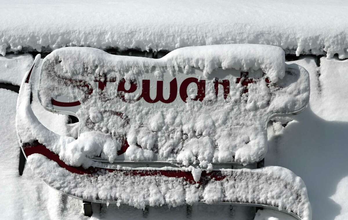 A Stewart’s Shops sign is plastered with snow on Route 443 at 85 on Wednesday, March 15, 2023, in New Scotland, N.Y.