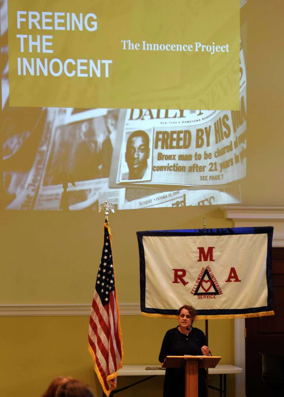 A speaker talks about the methods The Innocence Project uses to exonerate wrongly convicted people during a program in Greenwich in 2018.
