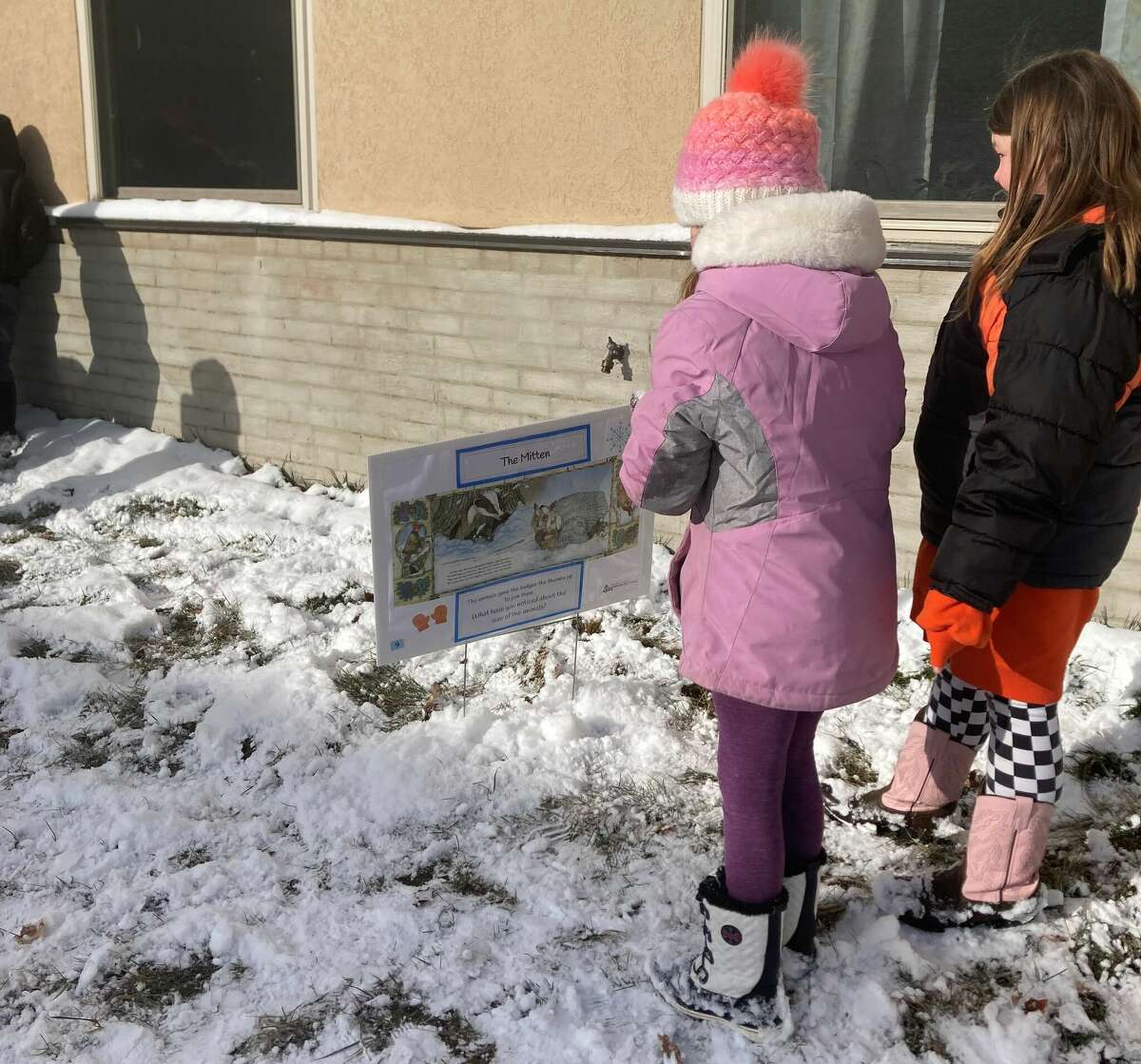 Elementary students at Bear Lake Schools read Jan Brett's "The Mitten" during a book walk provided by the Manistee Intermediate School District.