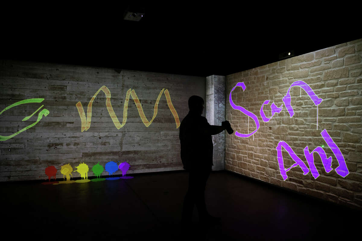 The laser graffiti is one of the interactive installations highlighted by a travel writer in a story spotlighting San Antonio attractions beyond the usual spots.