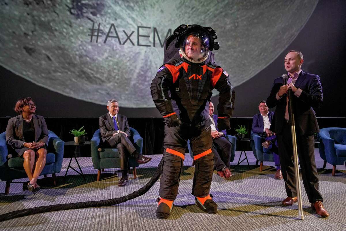 Axiom Space EVA Chief Engineer, Jim Stein demonstrates a new spacesuit developed by the Houston-based company for NASA’s Artemis program, which aims to send astronauts back to the moon.