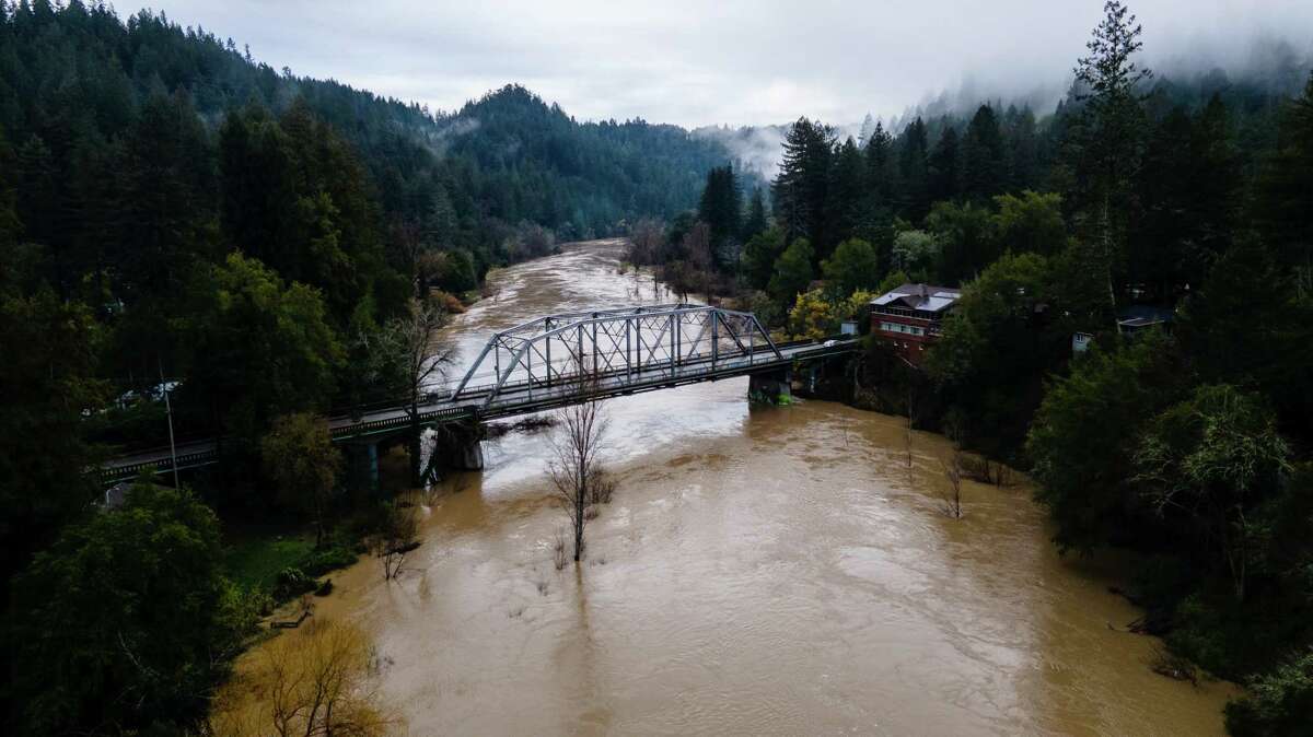 The Russian River flows underneath the Hacienda Bridge in Forestville on March 11. The parade of storms has vastly relieved California's drought, while causing other problems. 