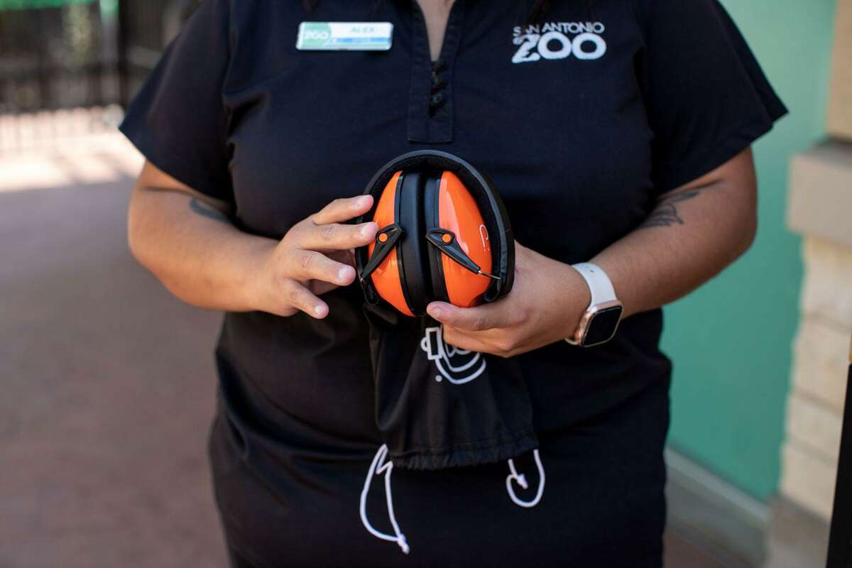 Alex Rodriguez, who spearheads the San Antonio Zoo’s diversity programs, holds a pair of noise canceling headphones included in the KultureCity sensory bags Friday.
