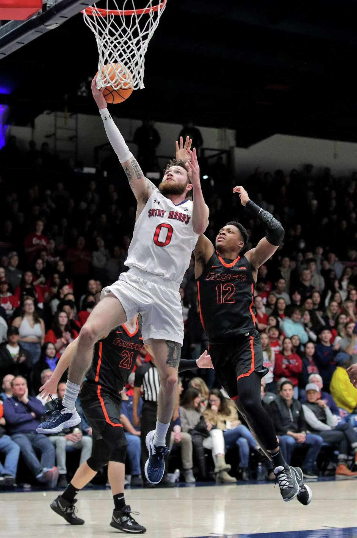Logan Johnson (0) goes up for a shot in the first half as the St. Mary’s Gaels played the Pacific Tigers at University Credit Union Arena in Moraga, Calif., on Thursday, February 23, 2023.