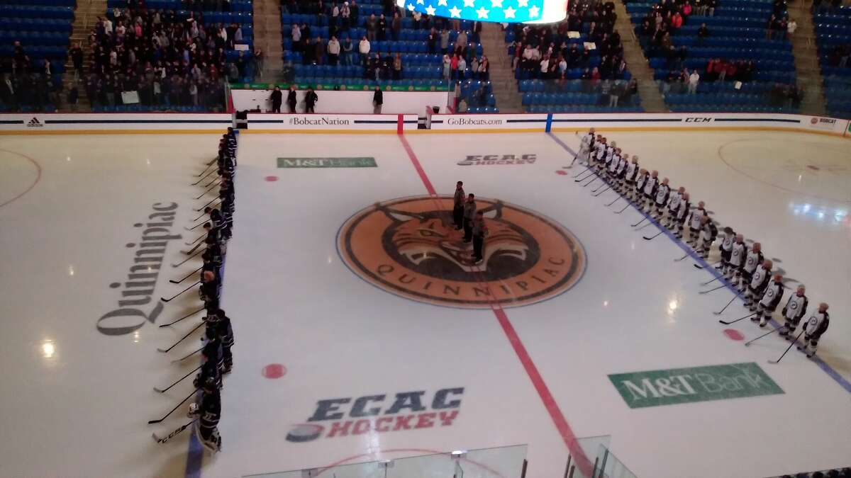 North Branford (left) and North Haven line up for the national anthem before their CIAC Division II boys hockey semifinal game at M&T Bank Arena on March 15, 2023. 