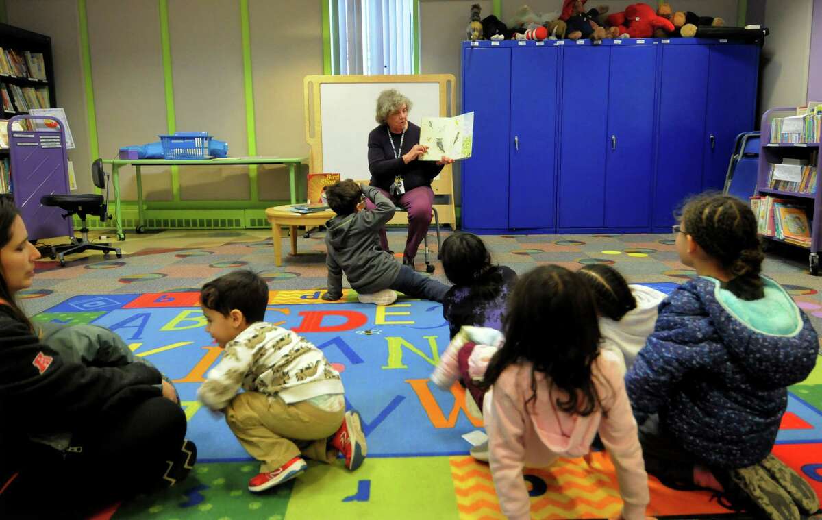 Children's Librarian Christine Furlo reads to kids during Danbury Library's Story Corner: "Fly Like a Bird" Storytime event at the library in Danbury, Conn., on Wednesday March 15, 2023. Children listened to stories about birds, learned some of the names of the colorful creatures, watched a video about a friendship between a cat and a canary and finally made a craft to celebrate them. To find out about future events at the library, visit: 