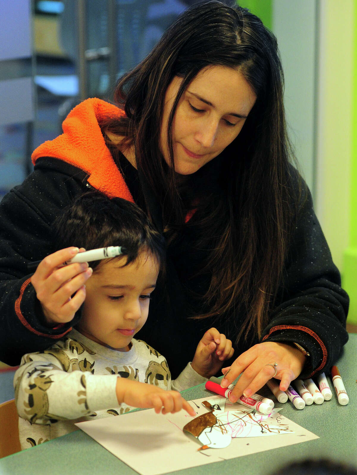 Deanna Valentin Helps Her Son Jason, 3, Work On A Bird Craft During Danbury Library'S Story Corner: &Quot;Fly Like A Bird&Quot; Storytime Event For Children In Danbury, Conn., On Wednesday March 15, 2023. Children Listened To Stories About Birds Read By Children'S Librarian Christine Furlo, Learned Some Of The Names Of The Colorful Creatures, Watched A Video About A Friendship Between A Cat And A Canary And Finally Made A Craft To Celebrate Them. To Find Out About Future Events At The Library, Visit: 