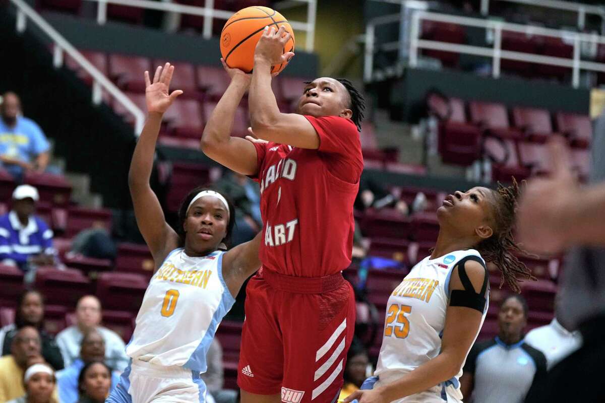 Sacred Heart guard Ny'Ceara Pryor (1) shoots between Southern's Diamond Hunter (0) and Genovea Johnson (25) during the first half of a First Four game in the NCAA women's college basketball tournament Wednesday, March 15, 2023, in Stanford, Calif.