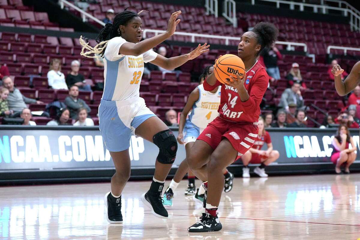Sacred Heart guard Sierra Johnson (24) drives to the basket against Southern center Xyllize Harrison (32) during the first half of a First Four game in the NCAA women's college basketball tournament Wednesday, March 15, 2023, in Stanford, Calif.