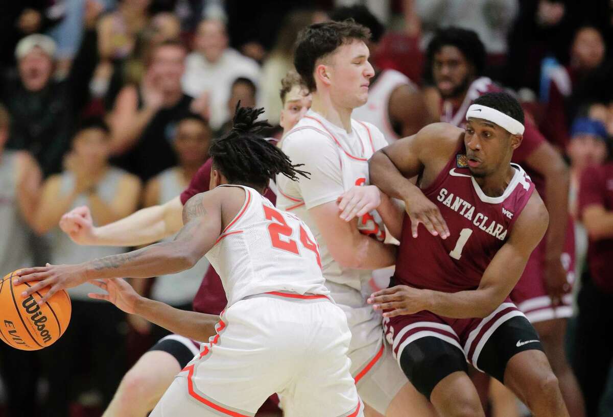 Carlos Stewart (1) is screened by Cameron Huefner (25) as Donte Powers (24) In the second half as the Santa Clara Broncos take on the Sam Houston State Bearkats at Leavey Center in Santa Clara, Calif., on Wednesday, March 15, 2023.