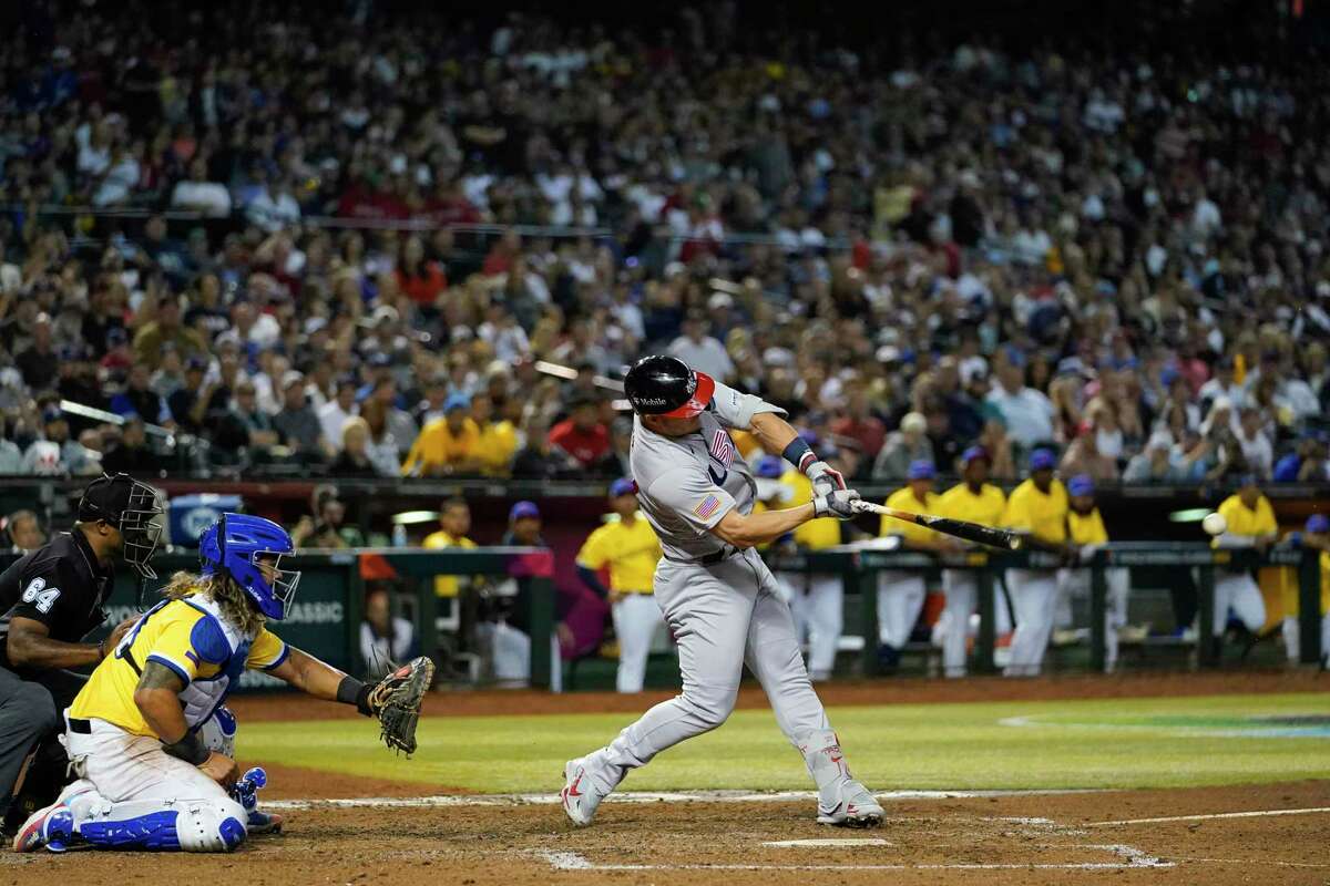 United States' Mike Trout hits a two-run single against Colombia during the fifth inning of a World Baseball Classic game in Phoenix, Wednesday, March 15, 2023. (AP Photo/Godofredo A. Vásquez)