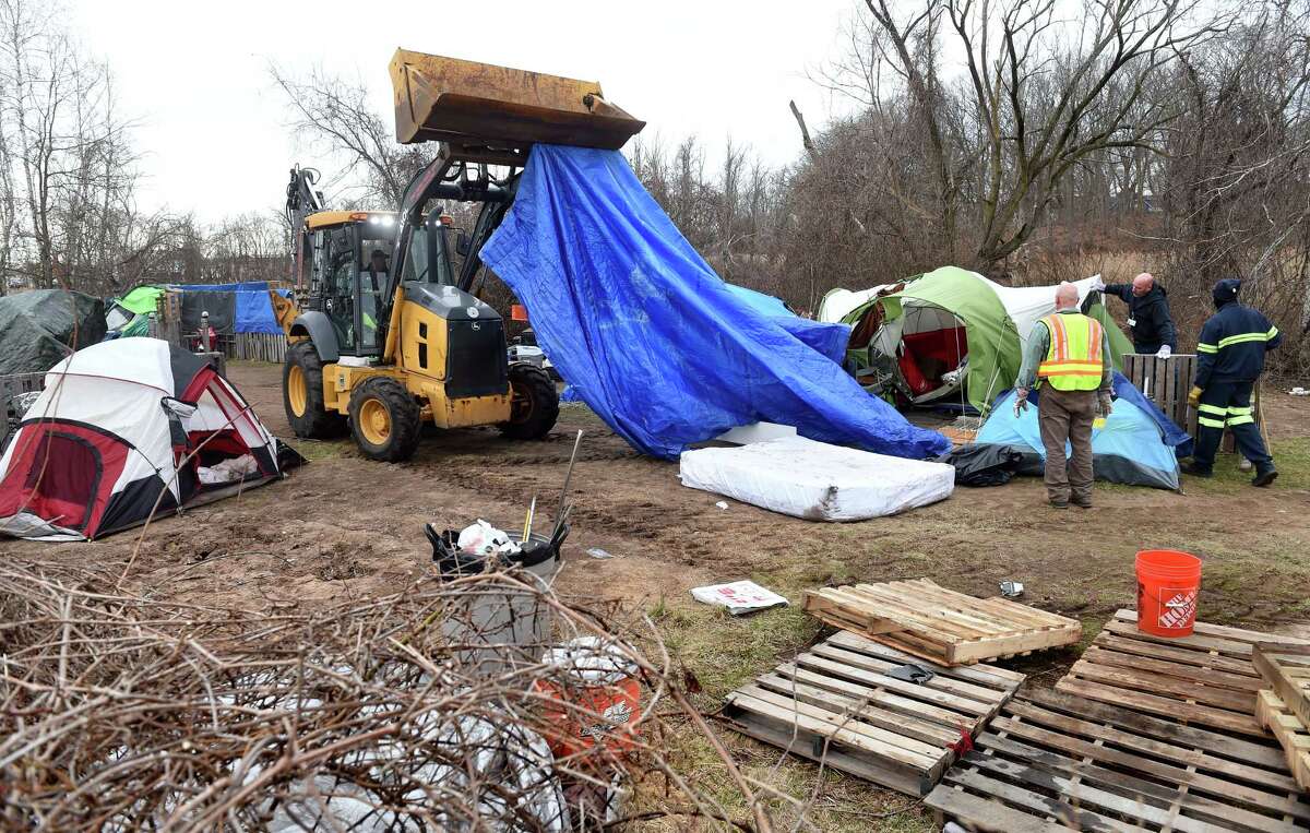 New Haven Public Works employees dismantle the Tent City community at West River Memorial Park in New Haven on March 16, 2023.