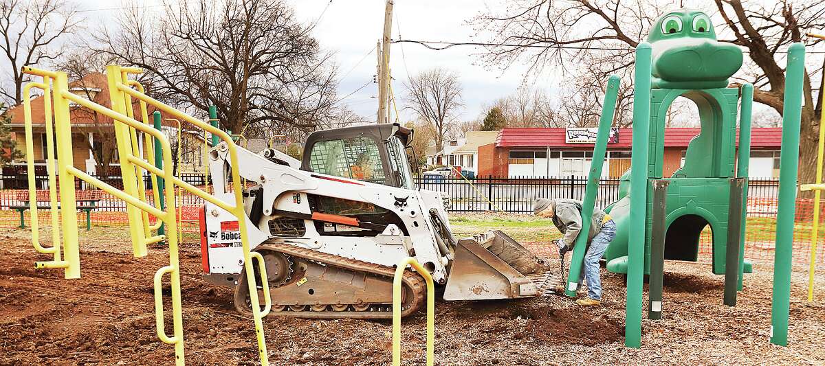 Workers were using a Bobcat to pull up the old playground adjacent to the Wood River Roundhouse Thursday.