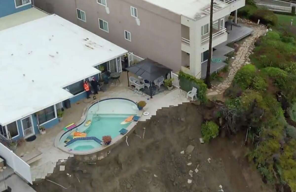 Calif. home and pool teeter on edge of cliff after landslide