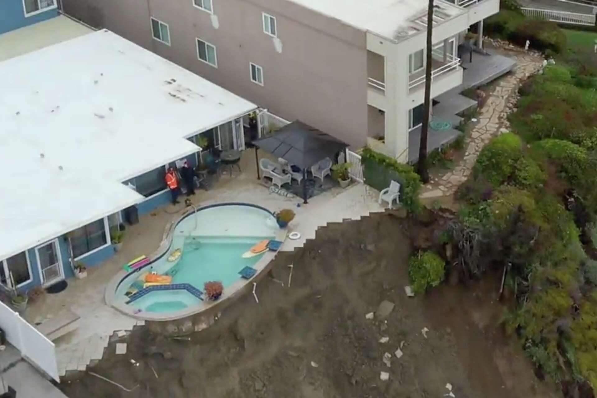 Calif. home and pool teeter on edge of cliff after landslide