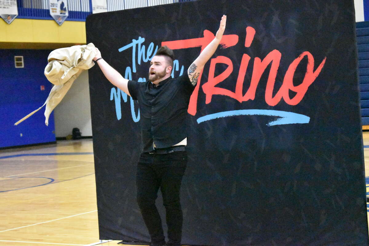 Magician Trino Schincariol, who goes by his stage name Trino, performed at Morley Stanwood High School Wednesday evening, the encore of the school's community night. Schincariol, show here, was placed in a straightjacket but successfully escapes. 