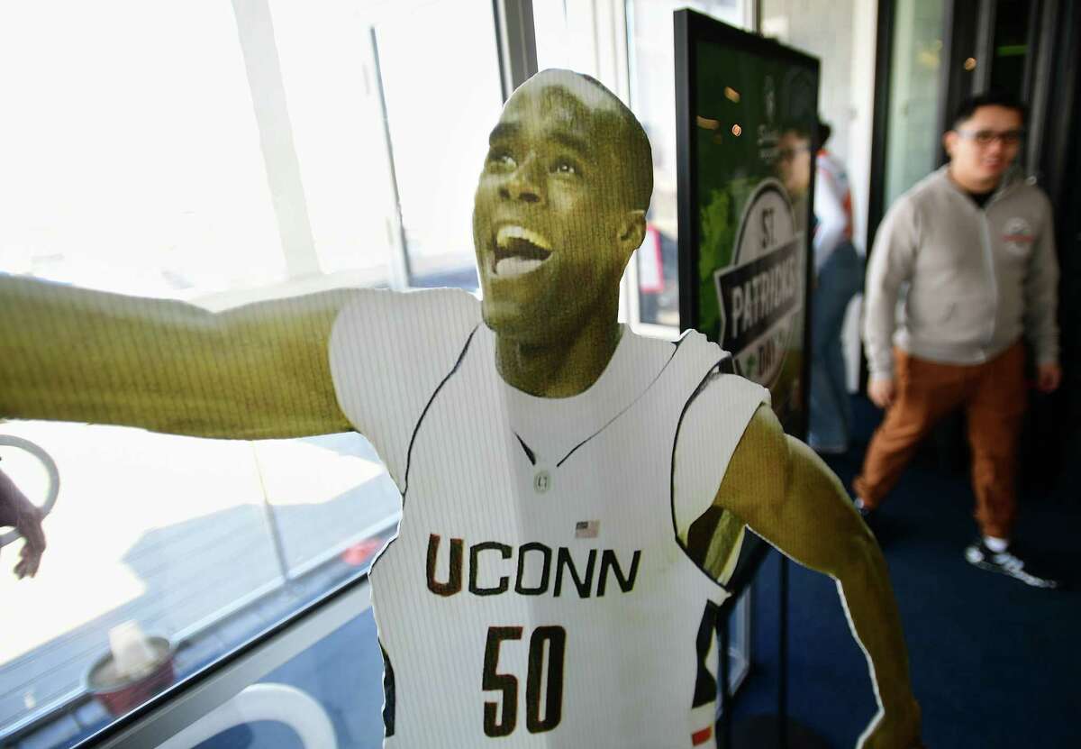 Cut outs of UCONN men's basketball players including former team star Emeka Okafor greet visitors to celebrate the opening day of the NCAA Men's Basketball Tournament at Dockside Brewery in Milford, Conn on Thursday, March 16, 2023.