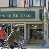 Bikers ride by First Republic Bank on Irving St. in San Francisco, Calif., on Thursday, March 16, 2023.