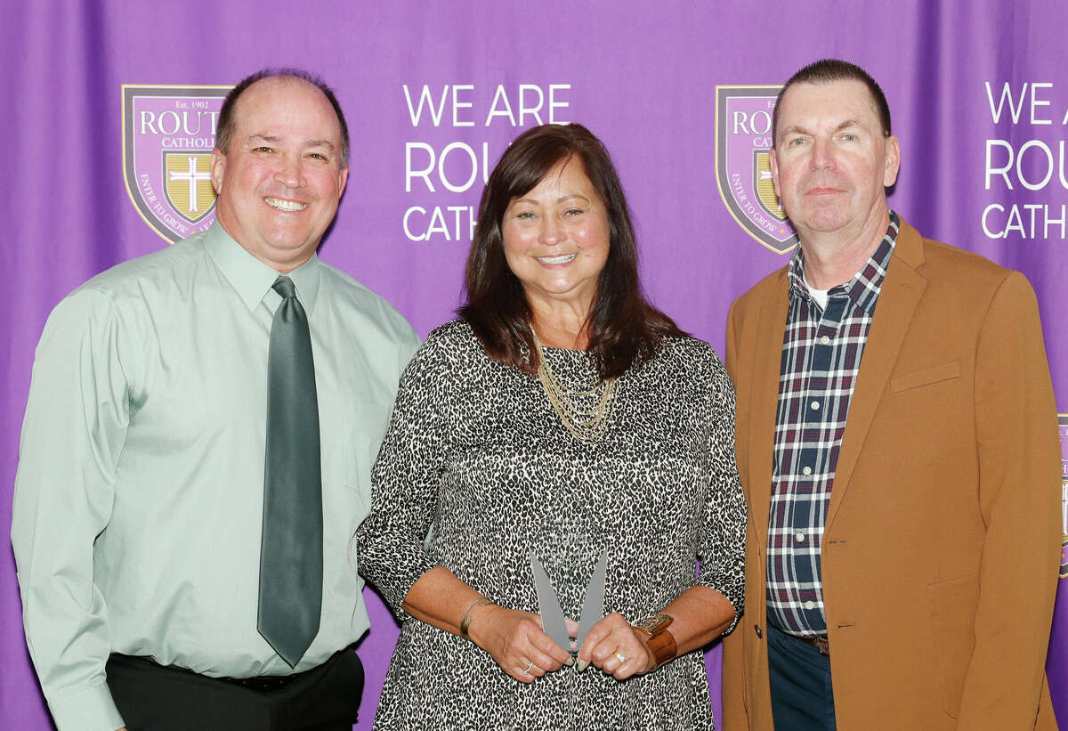 Rich (from left) and Judy Morrison receive the Friend of Routt Award from Joe Eilering.