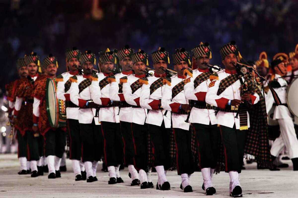 DELHI, INDIA - OCTOBER 14: Members of the Inidan military perform during the Closing Ceremony for the Delhi 2010 Commonwealth Games at Jawaharlal Nehru Stadium on October 14, 2010 in Delhi, India. (Photo by Daniel Berehulak/Getty Images)
