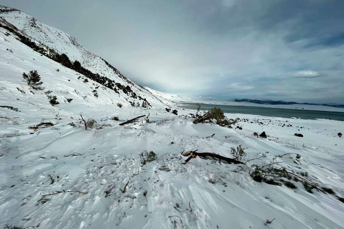 As much as 40 feet of snow covers Highway 395 along Mono Lake, the product of a series of avalanches in the eastern Sierra in late February.