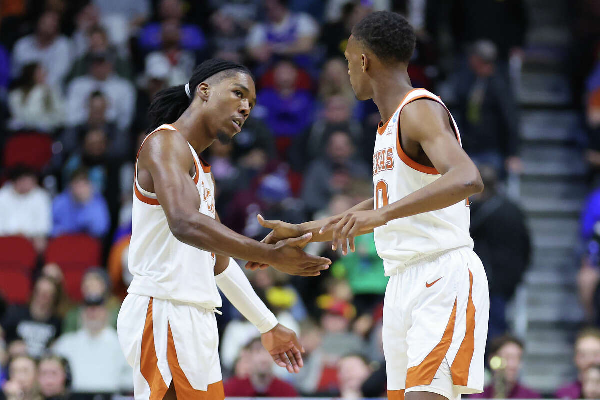DES MOINES, IOWA - MARCH 16: Marcus Carr #5 and Sir'Jabari Rice #10 of the Texas Longhorns celebrate after a 3-point basket during the second half against the Colgate Raiders in the first round of the NCAA Men's Basketball Tournament at Wells Fargo Arena on March 16, 2023 in Des Moines, Iowa. (Photo by Michael Reaves/Getty Images)