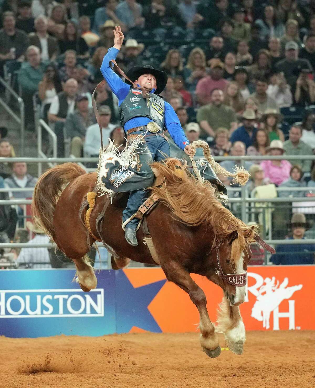 Rusty Wright ridges Zastron Acres in the saddle bronc riding competition during the Semifinal 2 round of Rodeo Houston at the Houston Livestock Show and Rodeo at NRG Park on Thursday, March 16, 2023 in Houston.