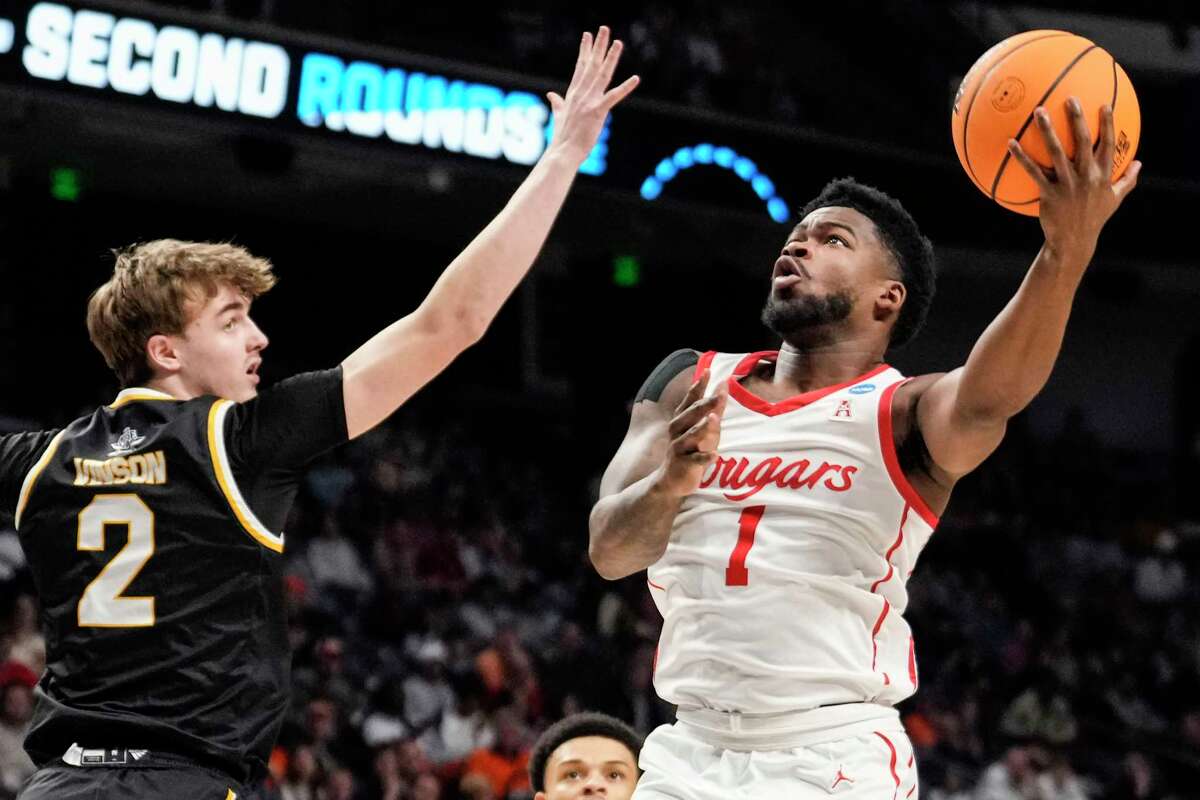 Houston guard Jamal Shead (1) takes a shot against Northern Kentucky guard Sam Vinson (2) during the first half of a first-round college basketball game in the NCAA Tournament on Thursday, March 16, 2023, in Birmingham, Ala.
